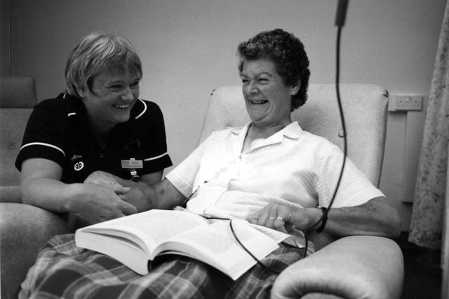 Ward sister Brenda Dillon checks in with leukemia patient Daphne Cuff September 1995.jpg